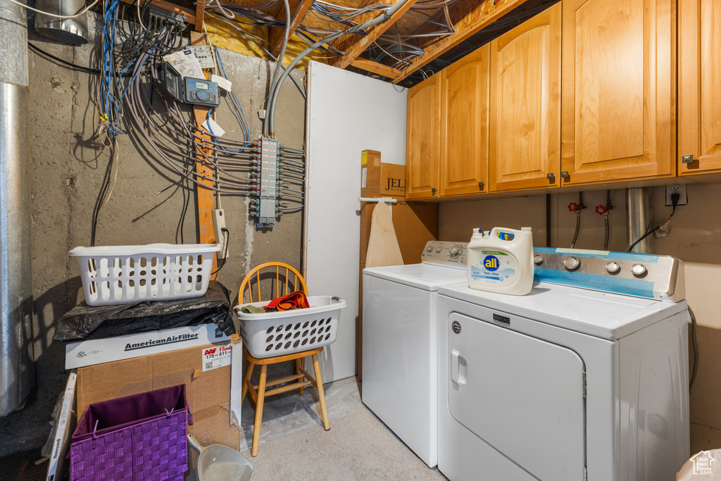 Laundry room with washer and dryer and cabinet space