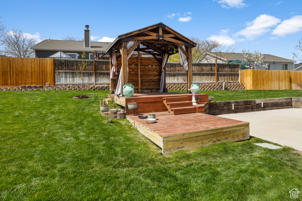 View of yard featuring a patio area, a fenced backyard, and a gazebo