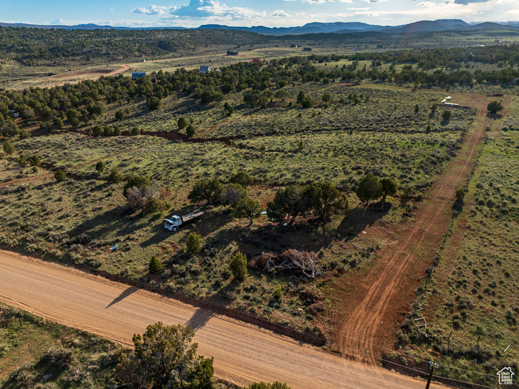 Birds eye view of property with a mountain view and a rural view