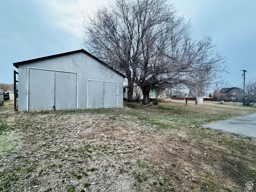 View of yard with an outbuilding and an outdoor structure