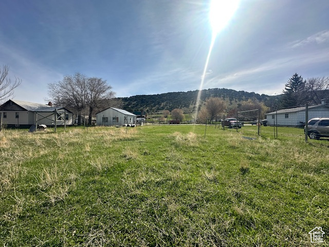 View of yard with a rural view