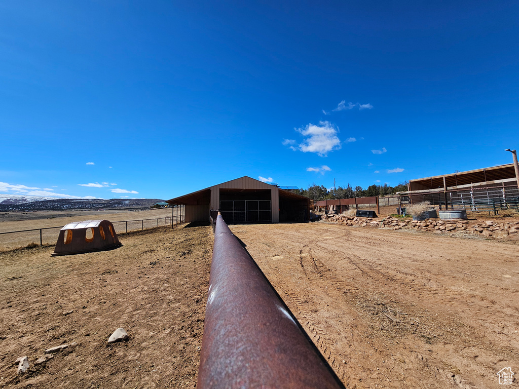 Exterior space featuring an outdoor structure, an exterior structure, and a garage