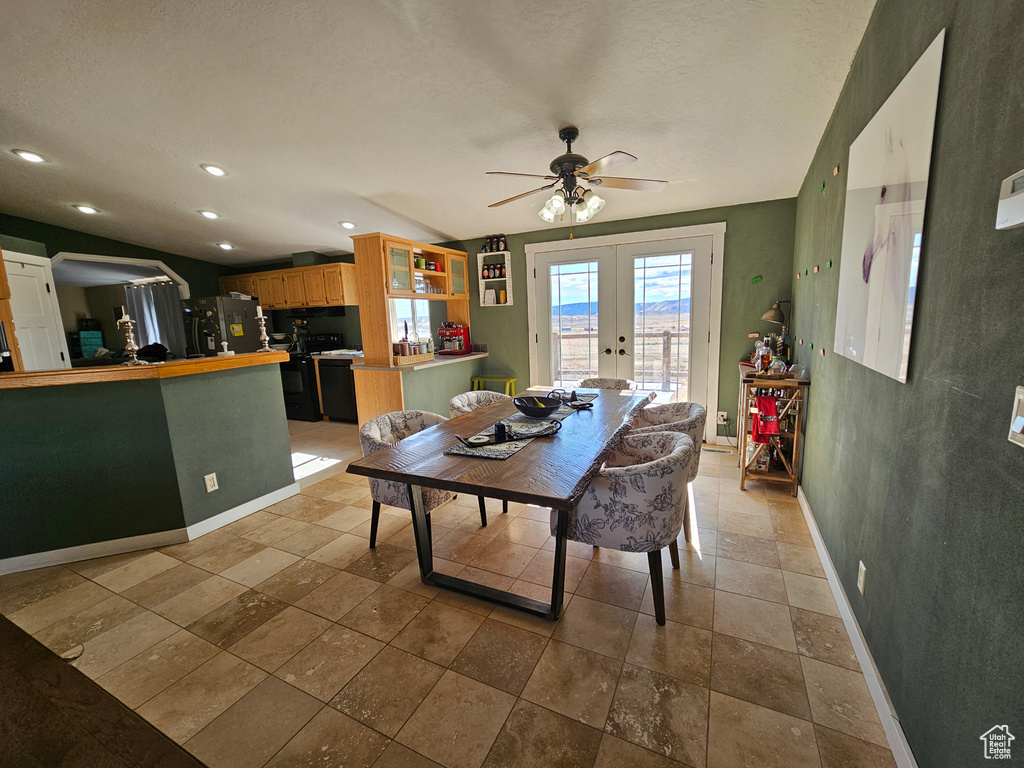 Dining area with vaulted ceiling, french doors, a ceiling fan, baseboards, and recessed lighting