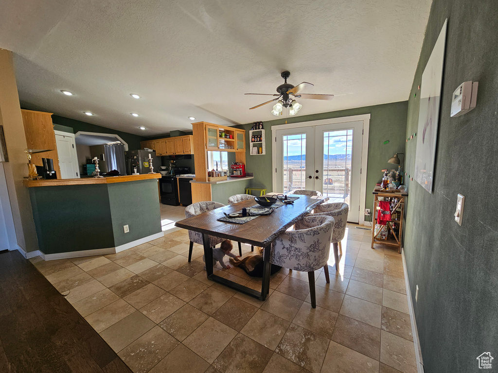 Dining area featuring recessed lighting, ceiling fan, french doors, and a textured ceiling