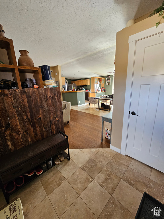 Interior space featuring a textured ceiling