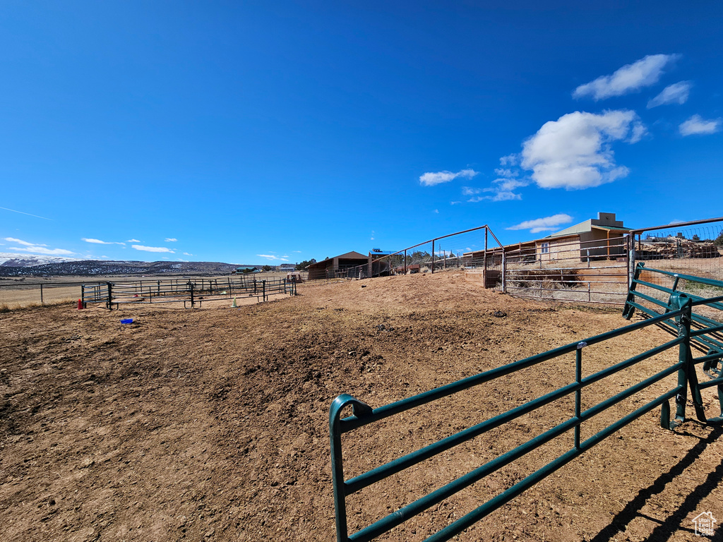 View of yard featuring an outbuilding and a rural view