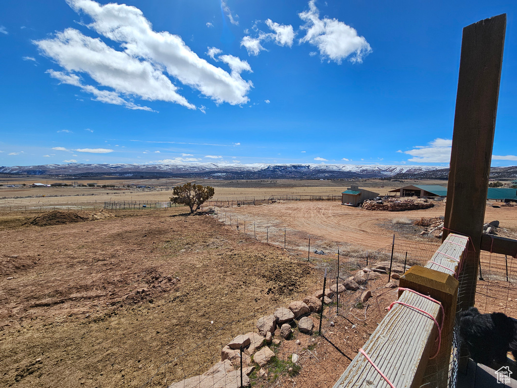 View of yard with a mountain view and a rural view