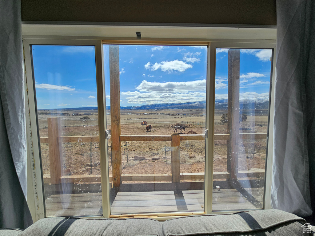 Doorway to outside featuring a mountain view