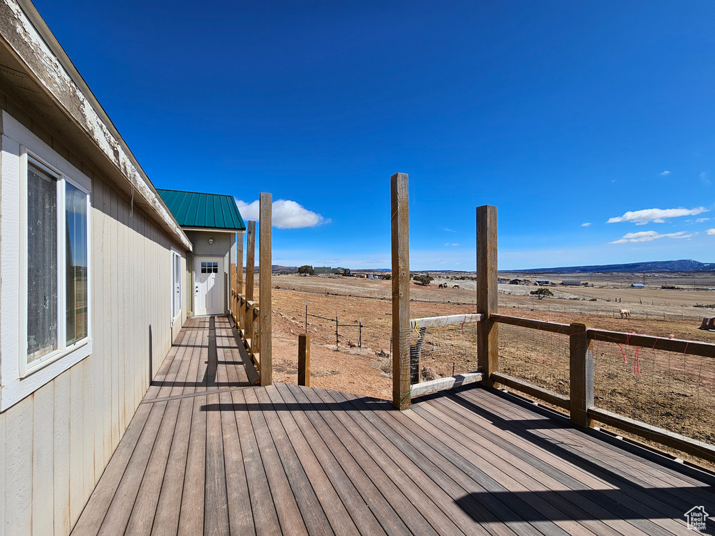 Wooden deck featuring a rural view