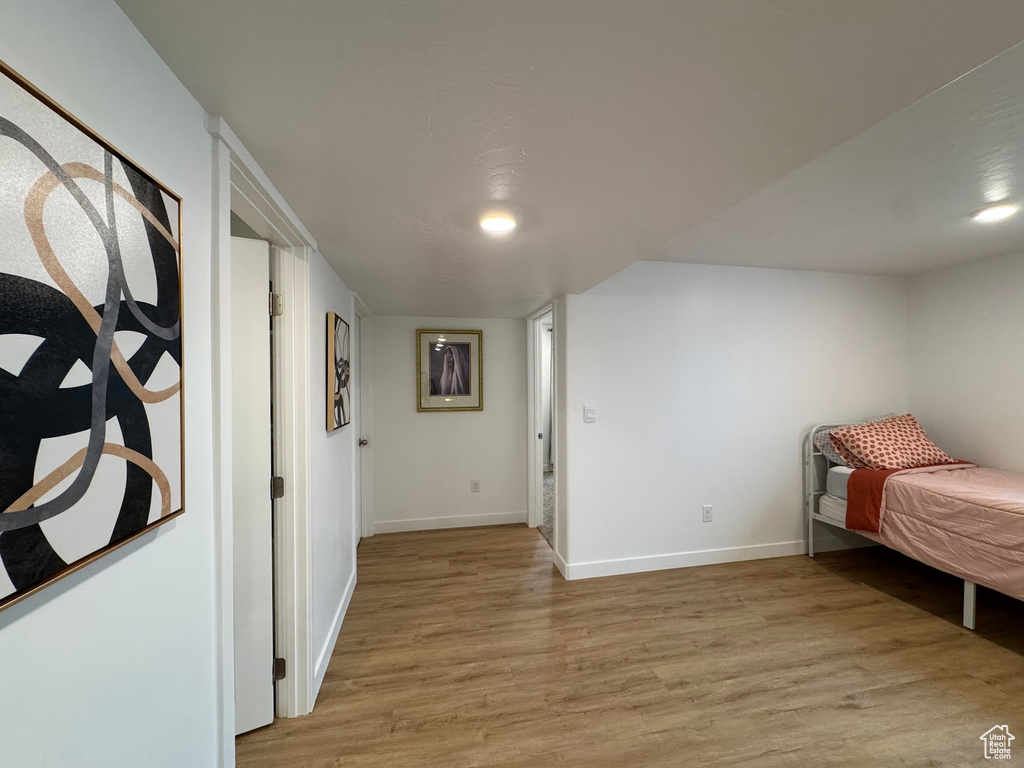 Bedroom featuring baseboards and light wood-style floors