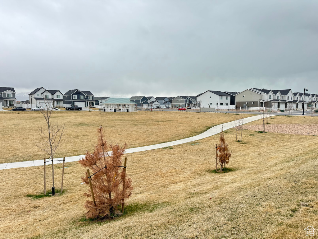 View of yard with fence and a residential view