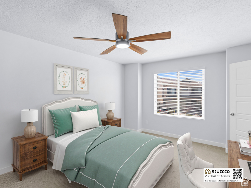 Bedroom featuring light colored carpet, baseboards, a ceiling fan, and a textured ceiling