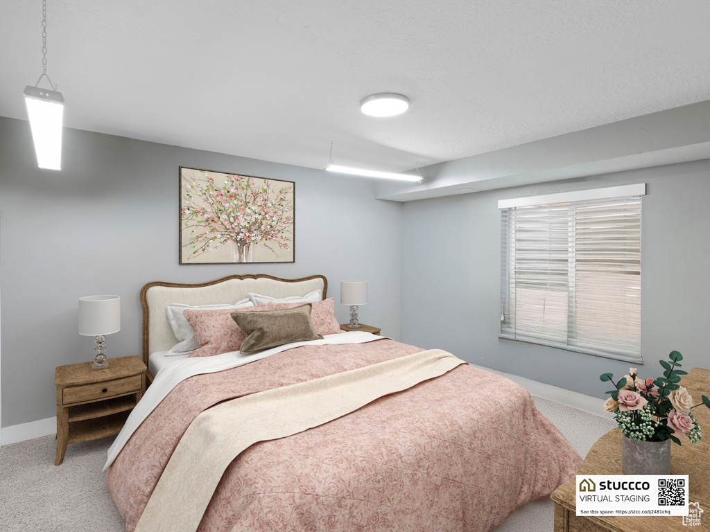 Carpeted bedroom with baseboards