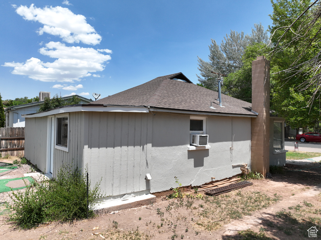 View of home's exterior featuring roof with shingles