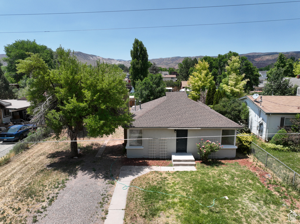 View of subject property with a mountainous background