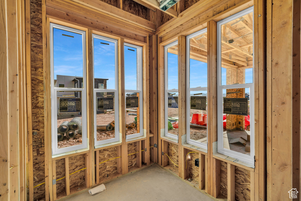 Unfurnished sunroom featuring a wealth of natural light