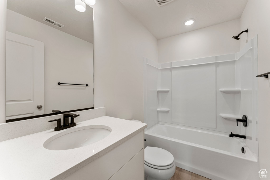Full bath featuring vanity, shower / tub combination, and recessed lighting