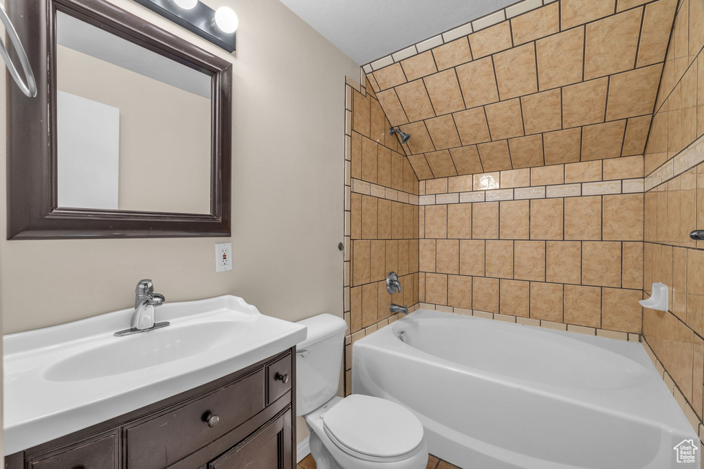 Full bath with toilet, vanity, and shower / bathtub combination