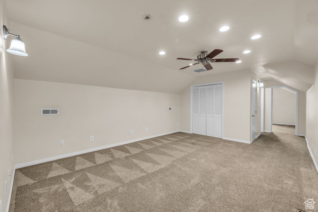 Bonus room featuring vaulted ceiling, carpet, a ceiling fan, baseboards, and recessed lighting
