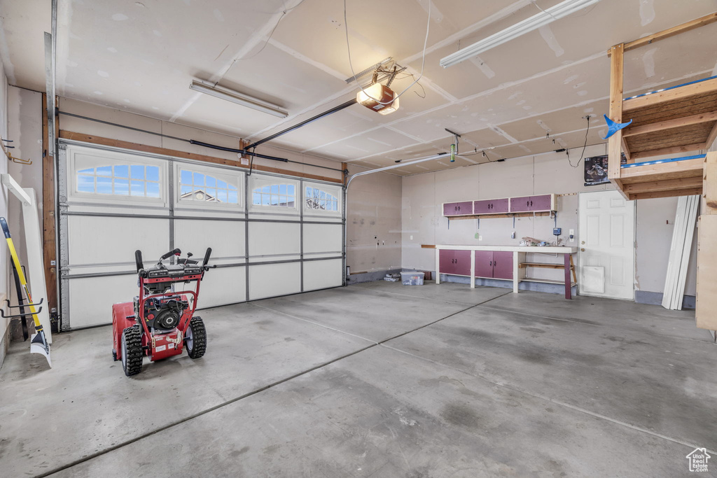 Garage featuring a garage door opener