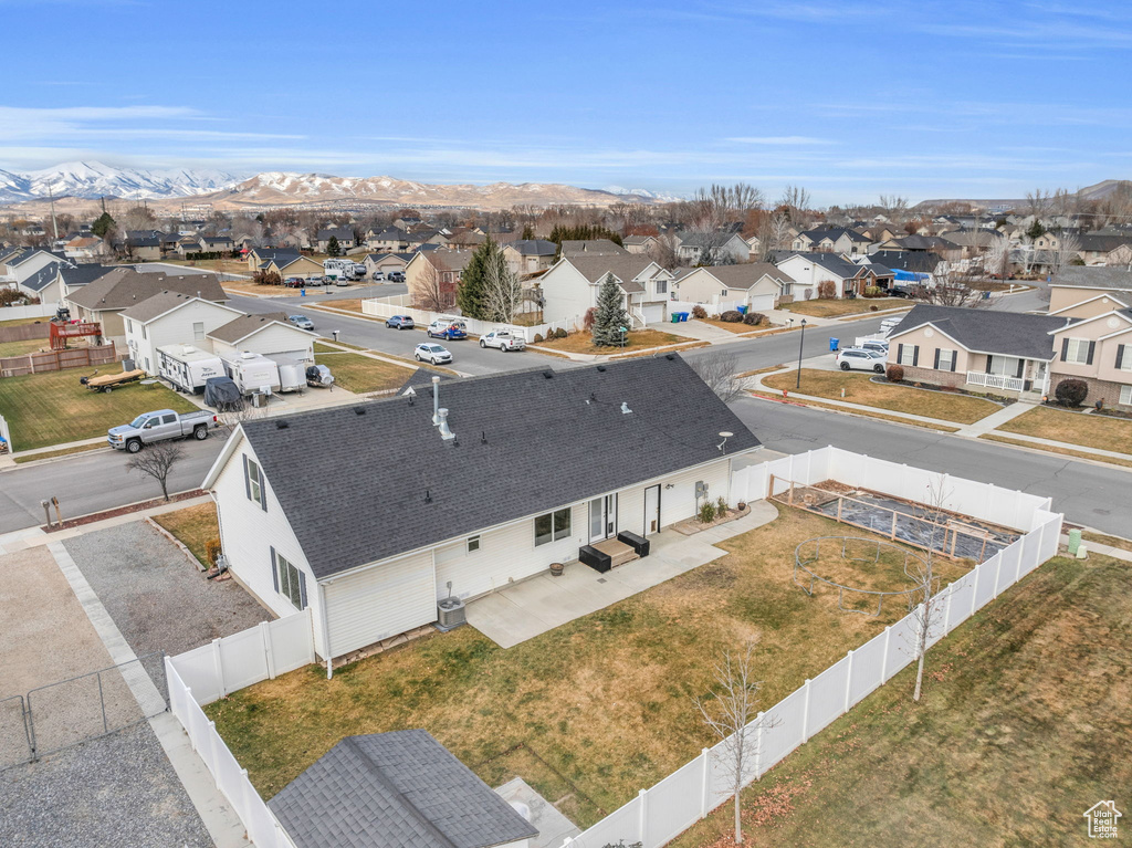 Drone / aerial view with a residential view and a mountain view