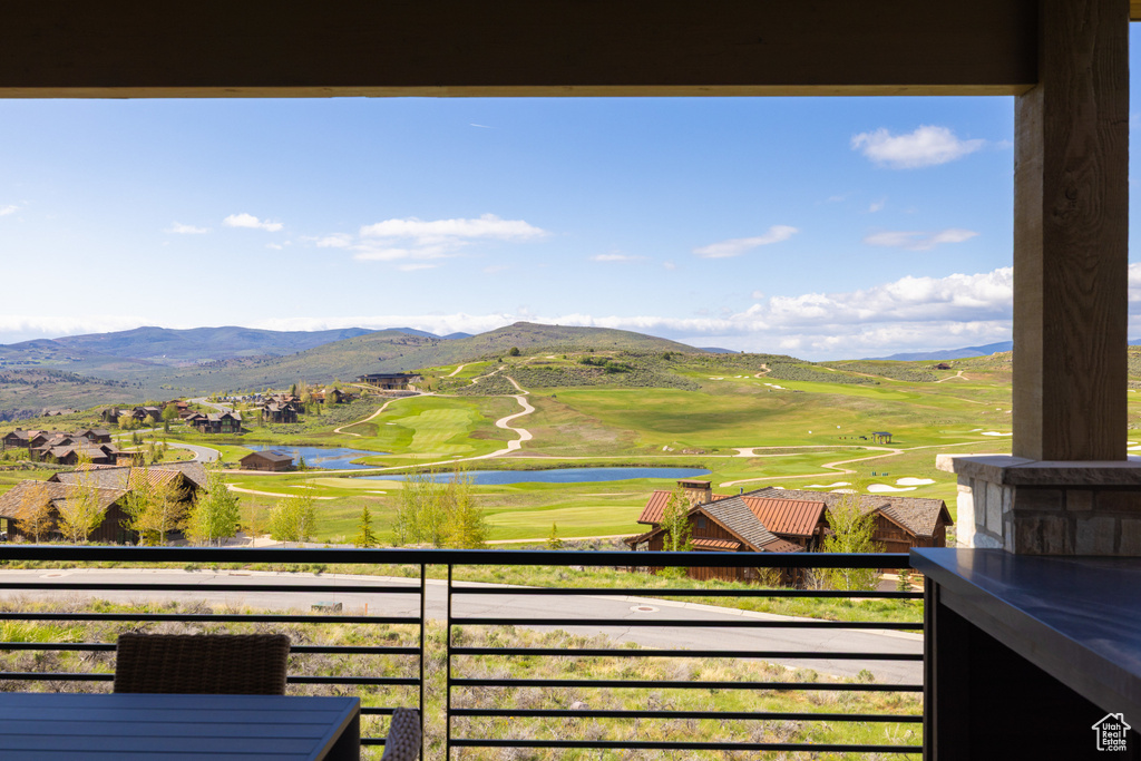 Mountain view featuring a large body of water and a local golf course