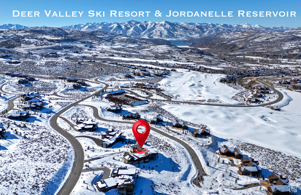 Snowy aerial view with a mountain view