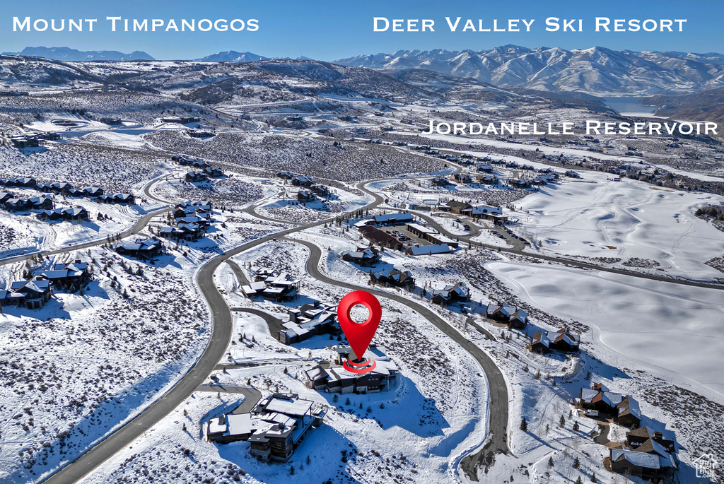 Snowy aerial view featuring a mountain view