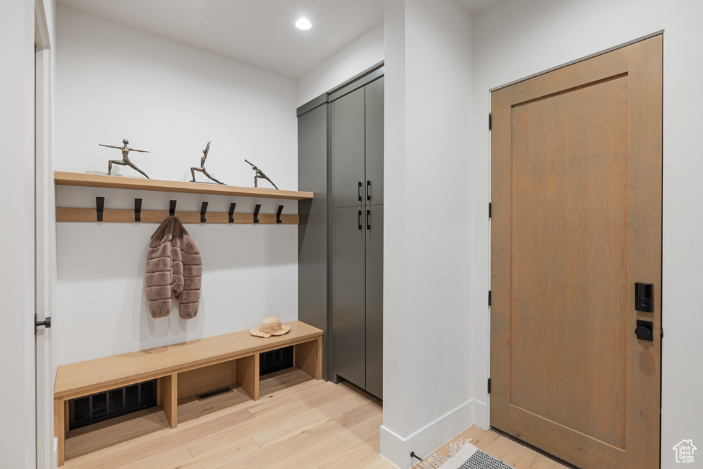 Mudroom featuring light wood-style flooring, baseboards, and recessed lighting