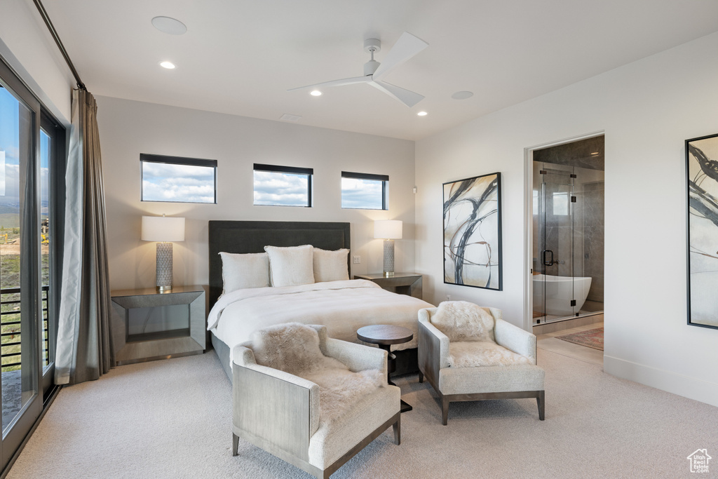 Bedroom with multiple windows, recessed lighting, light colored carpet, connected bathroom, and baseboards