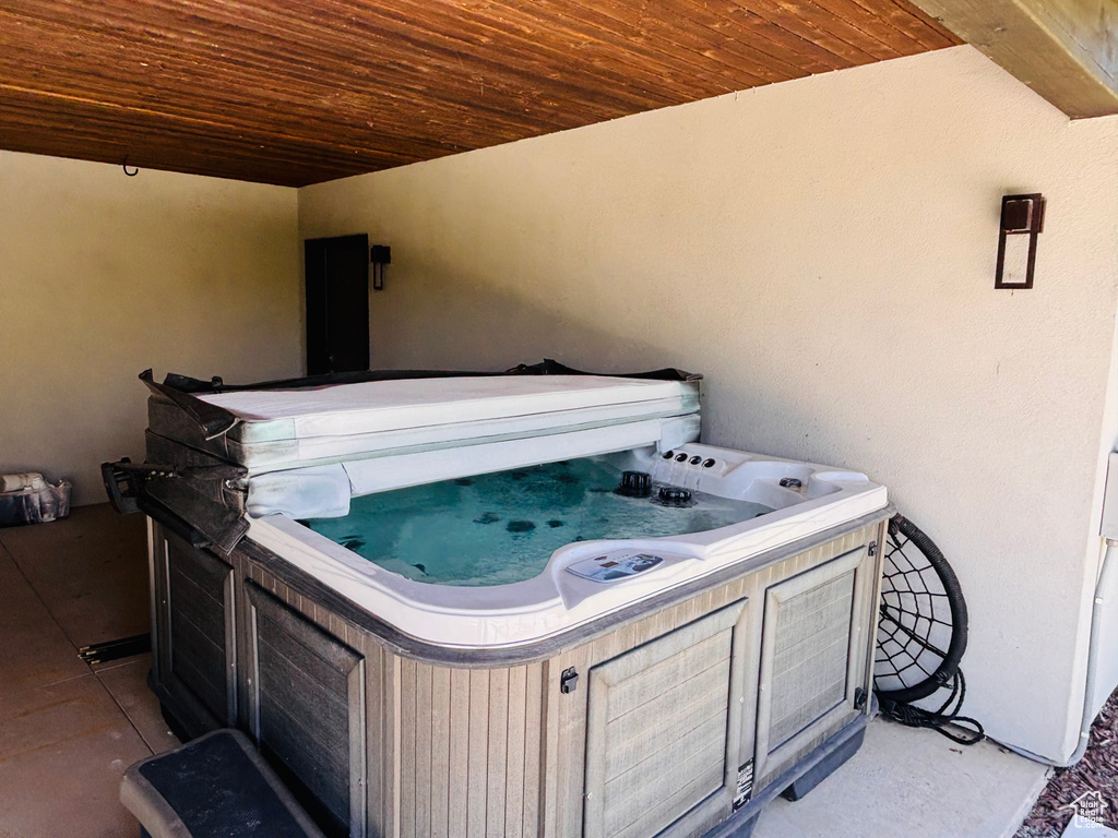 View of patio / terrace featuring a hot tub