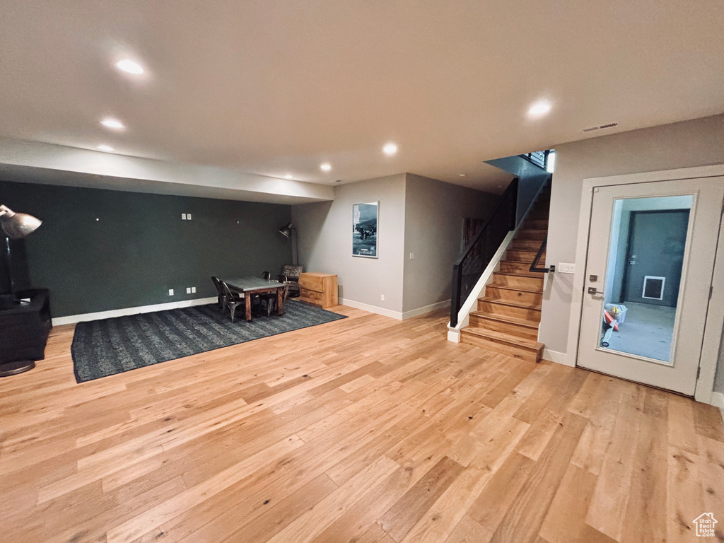 Interior space featuring light wood-style flooring, recessed lighting, and stairway