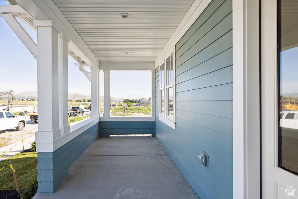 Porch featuring a mountain view
