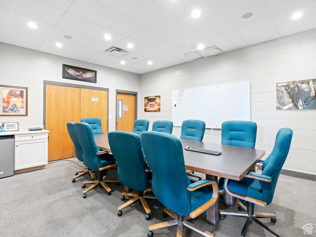 Office featuring a drop ceiling, recessed lighting, light carpet, and visible vents