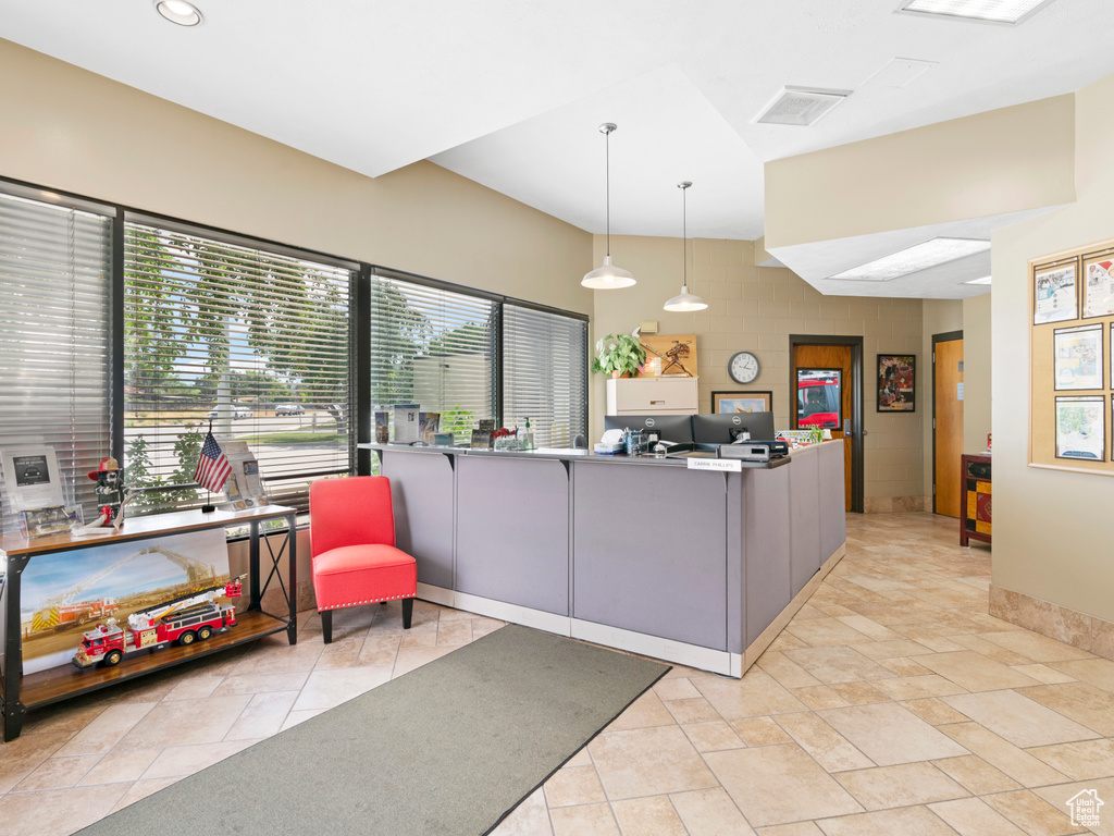 Living area featuring recessed lighting and visible vents