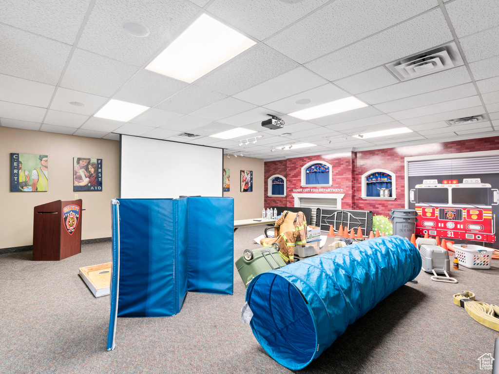 Game room with baseboards, visible vents, and a paneled ceiling