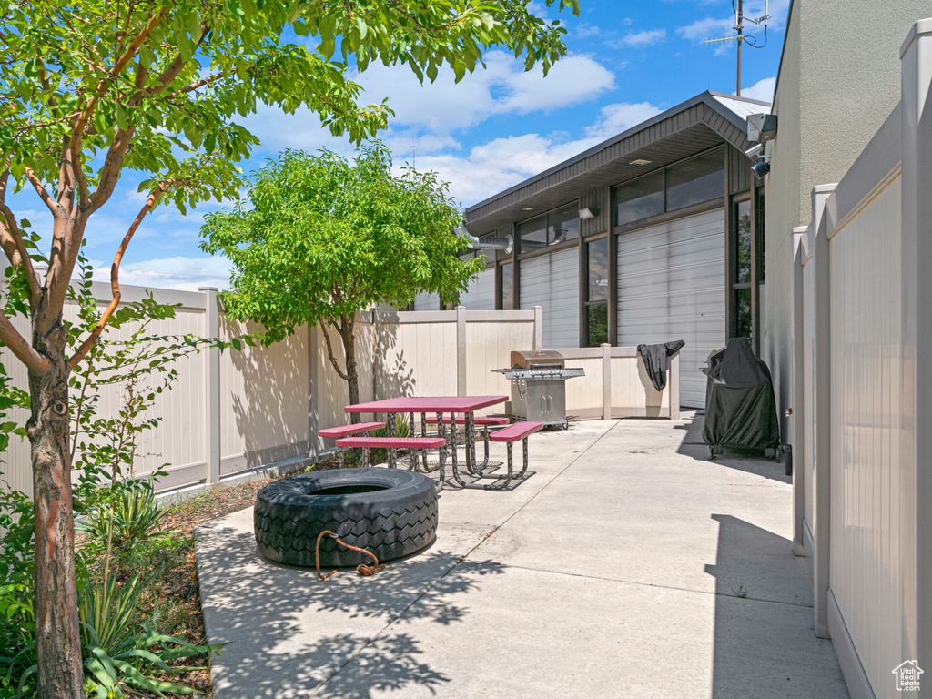 View of patio / terrace with a fenced backyard and area for grilling