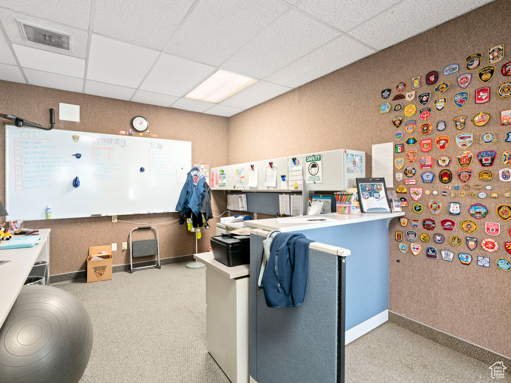 Office with a drop ceiling and visible vents