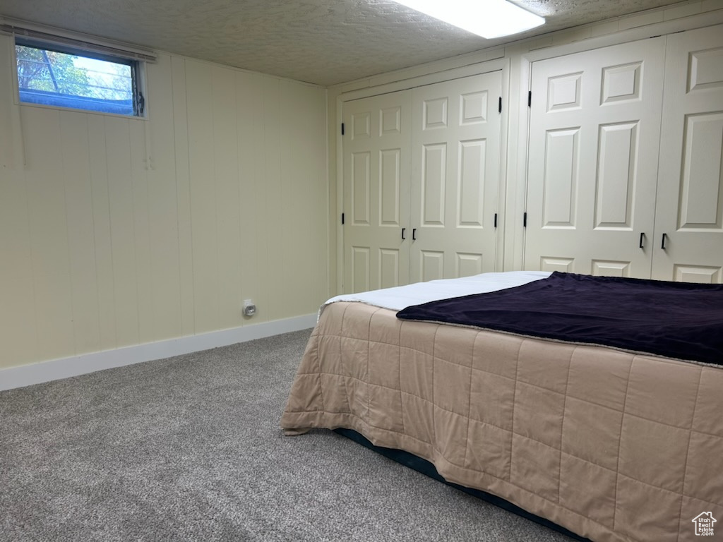 Bedroom featuring baseboards and carpet flooring