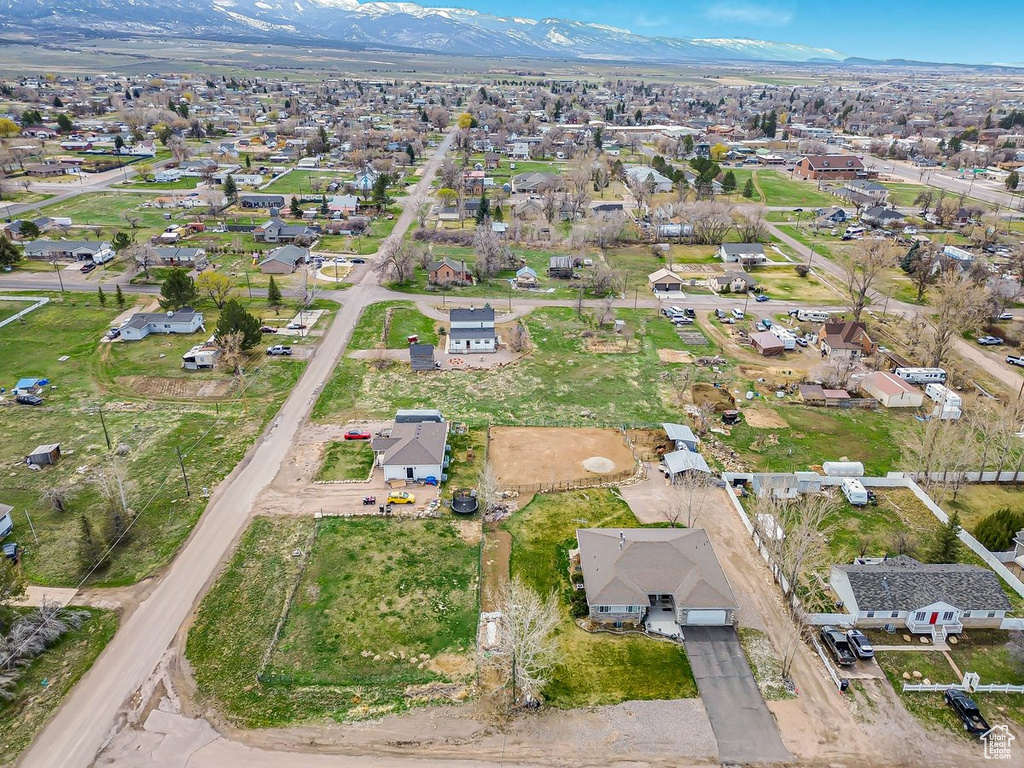 Birds eye view of property featuring a mountain view and a residential view