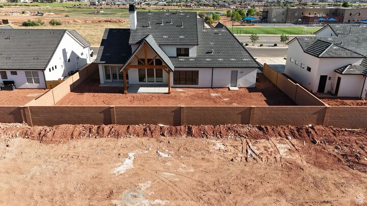 Rear view of house featuring stucco siding