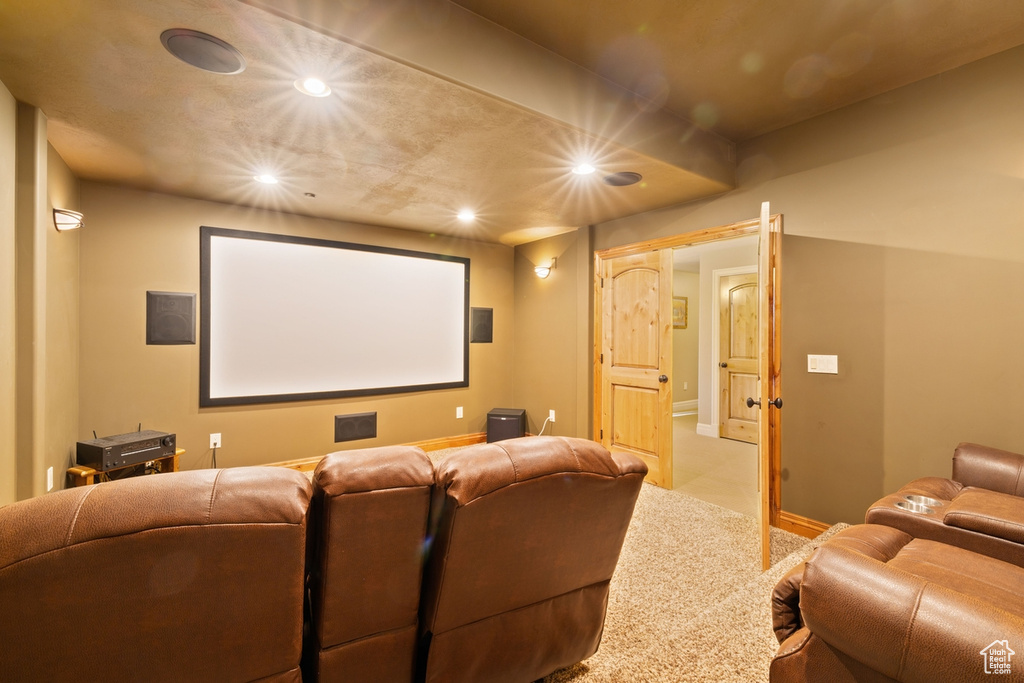 Cinema room with recessed lighting, light colored carpet, and baseboards