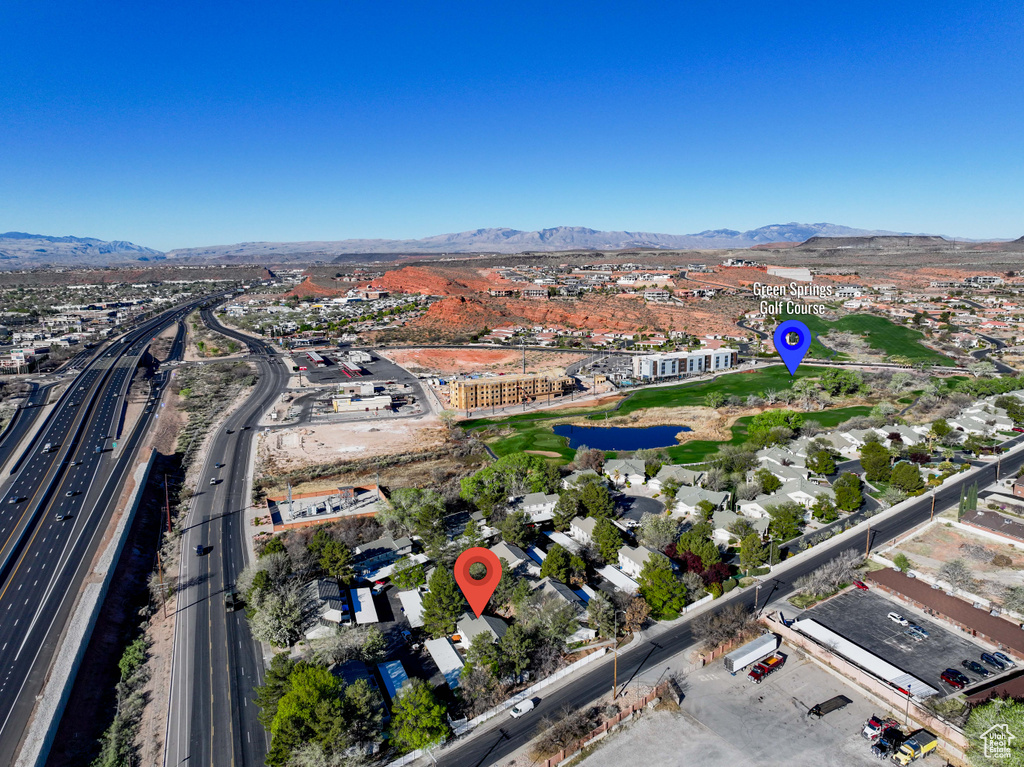 Birds eye view of property with a mountain view