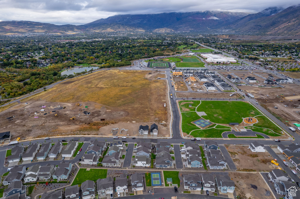 Birds eye view of property with a mountain view and a residential view
