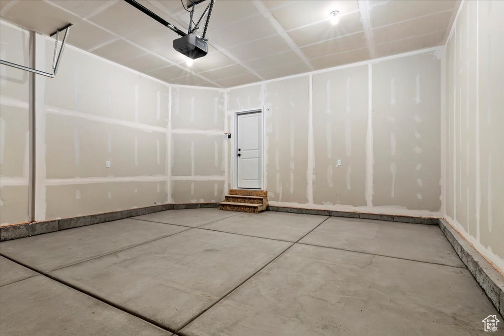 Garage featuring a garage door opener