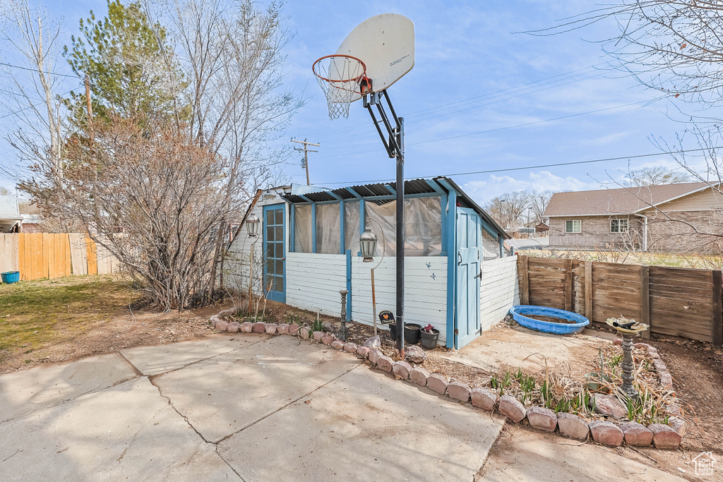 View of outdoor structure with a fenced backyard and an outdoor structure