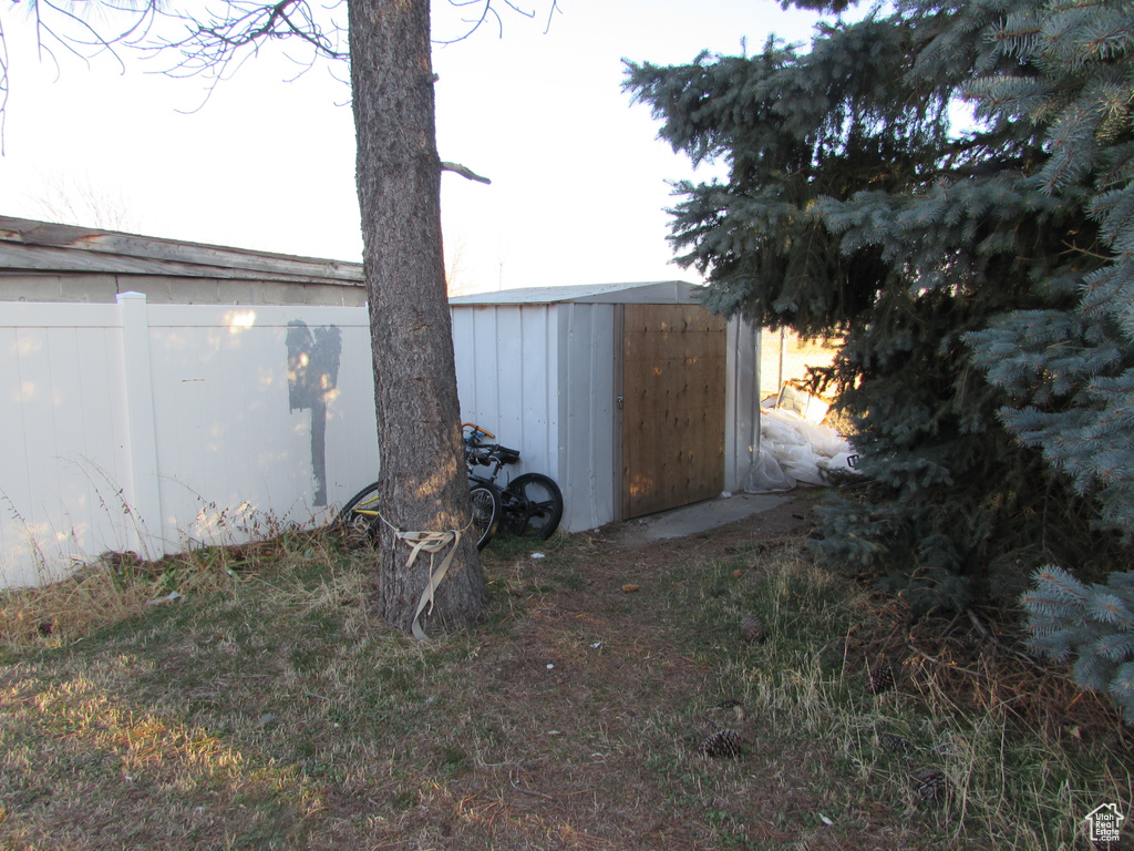 View of shed with fence