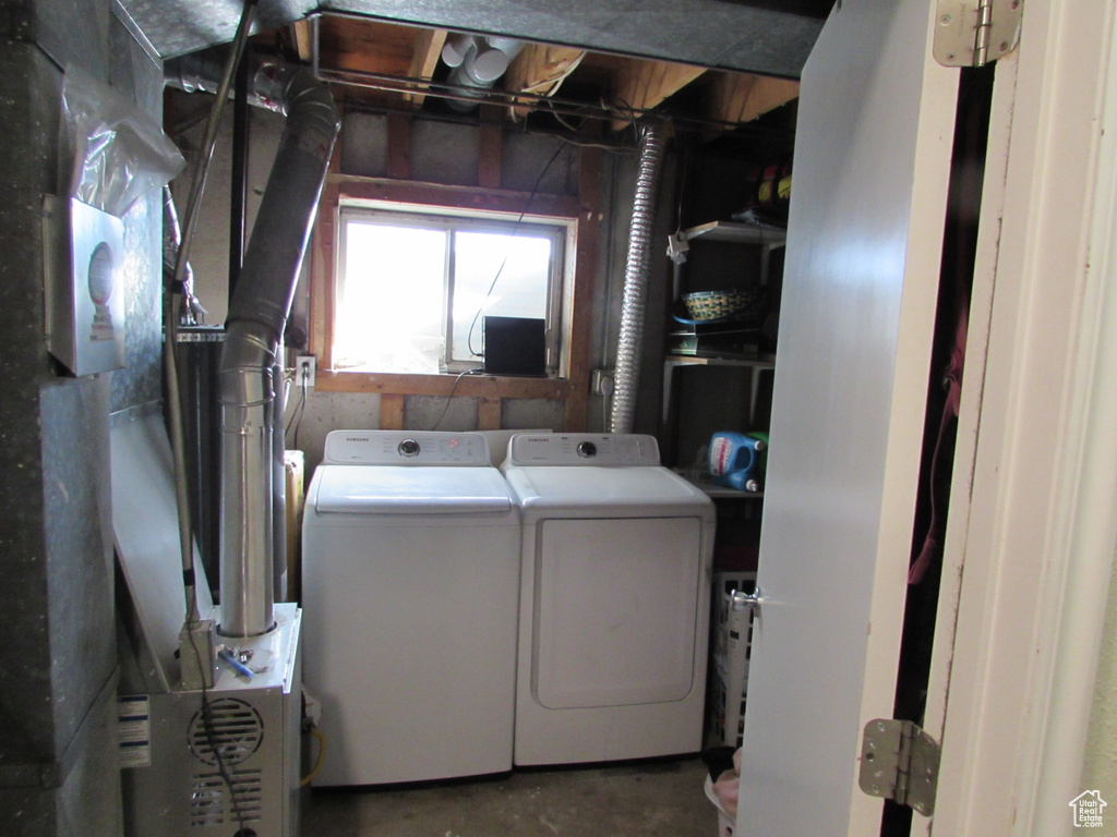 Laundry area with laundry area and washing machine and clothes dryer