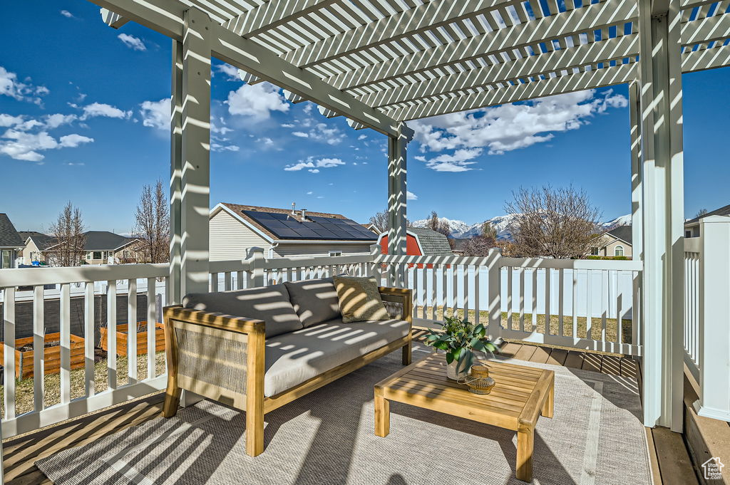 View of patio / terrace with a pergola, an outdoor living space, and a residential view