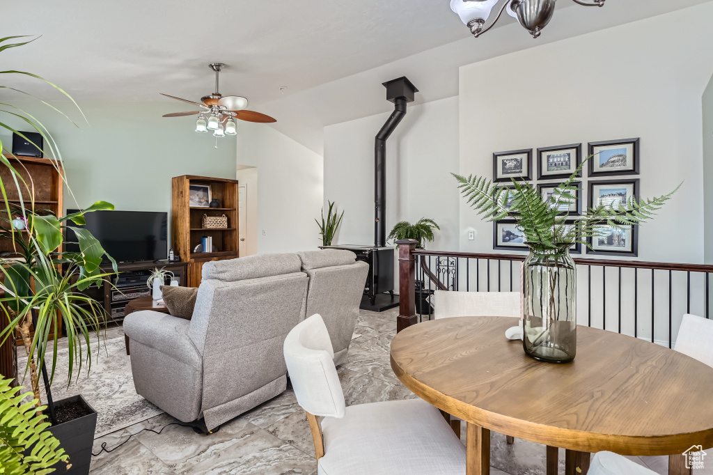 Living room featuring a ceiling fan and lofted ceiling